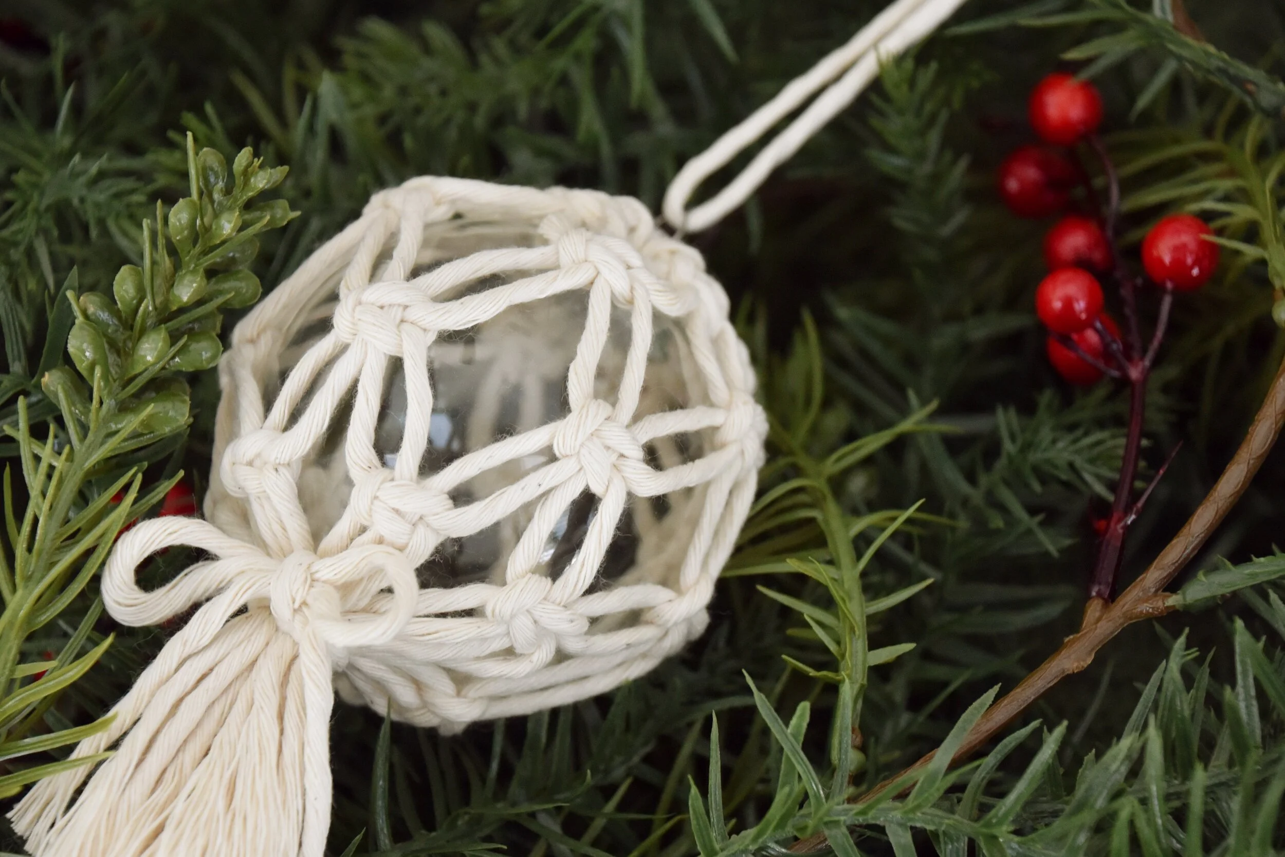 A macram&eacute; bauble Christmas decoration