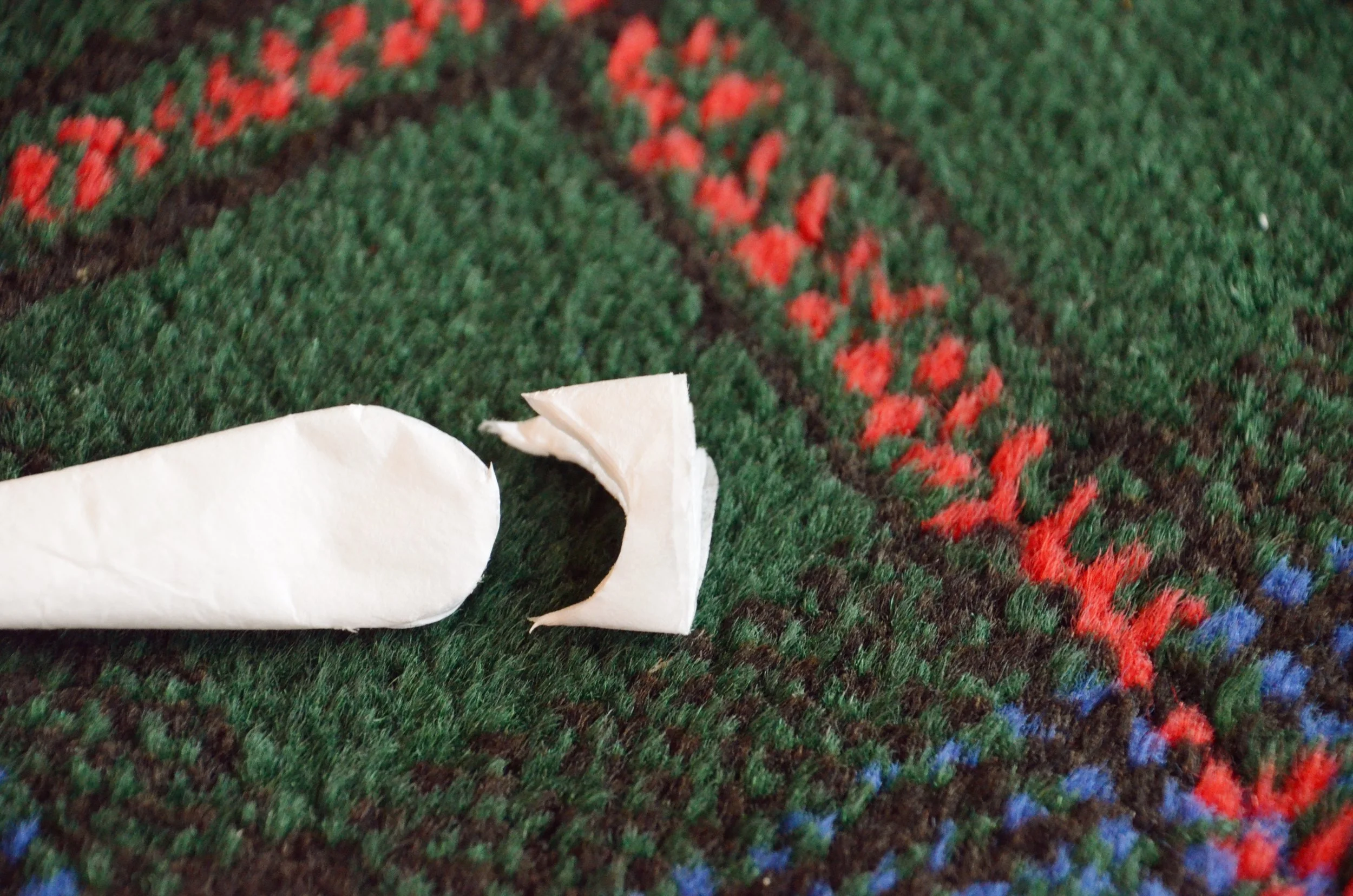 Cutting curved petal shapes from the folded coffee filter