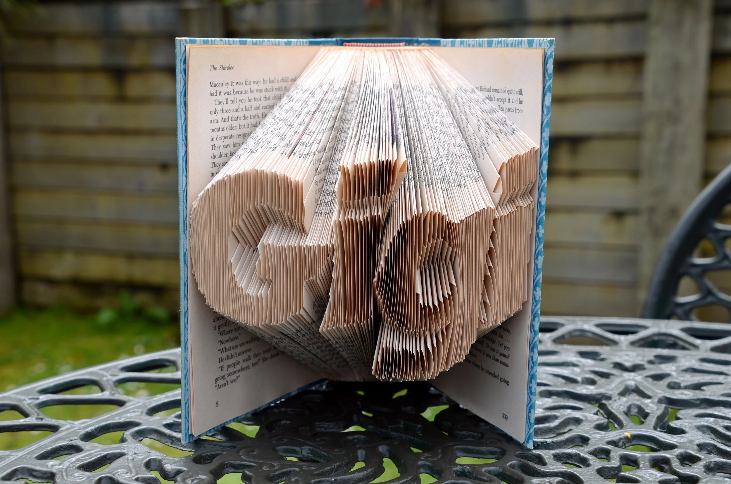 Folding a page inward along the marked line