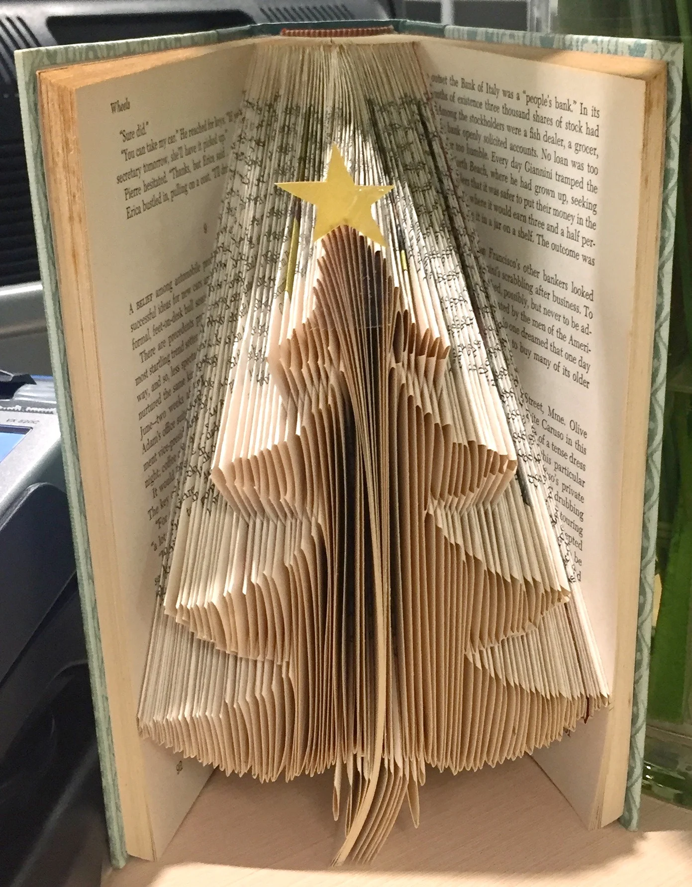 Continuing to fold pages through the book