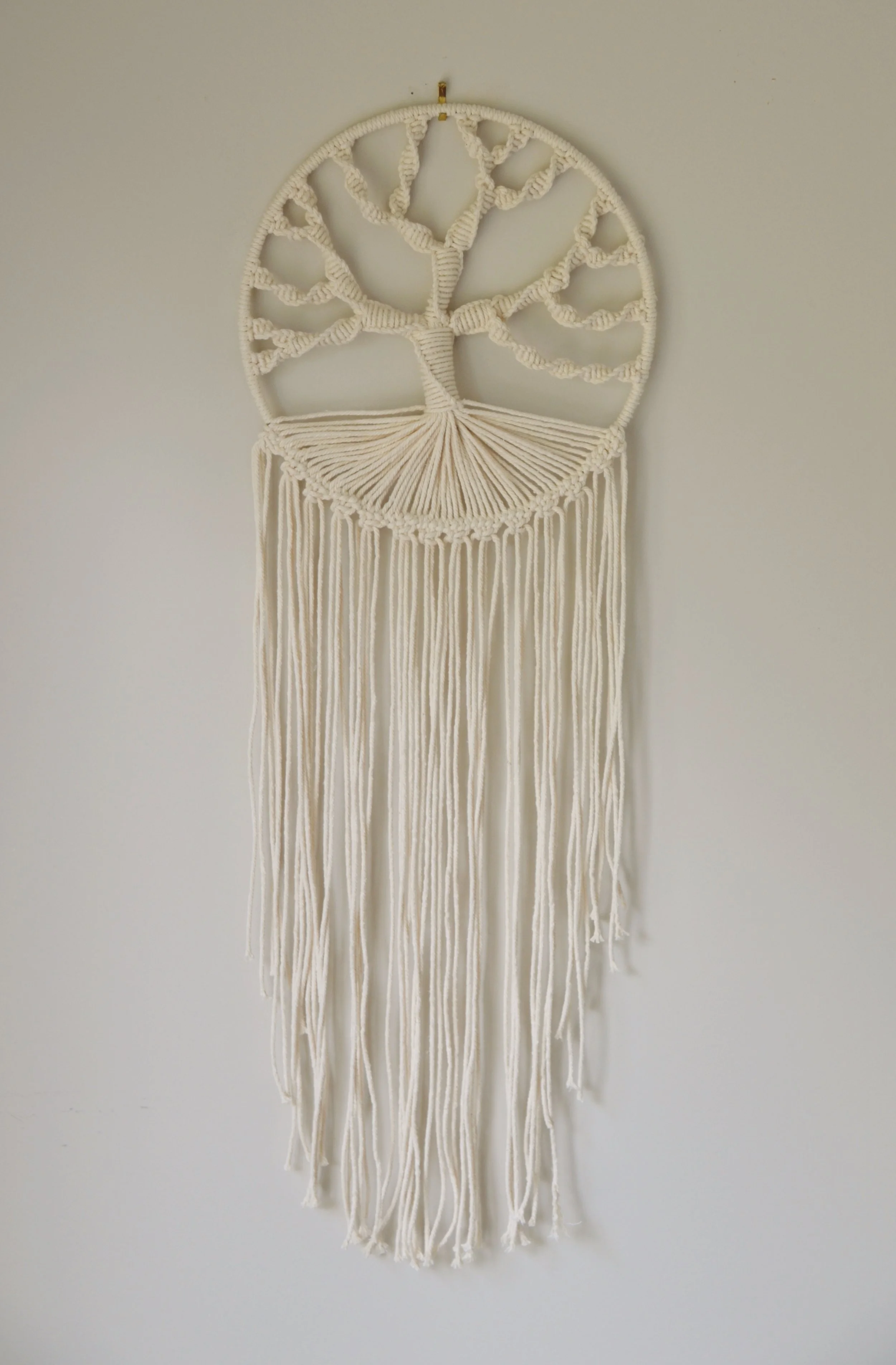 A handmade macram&eacute; necklace