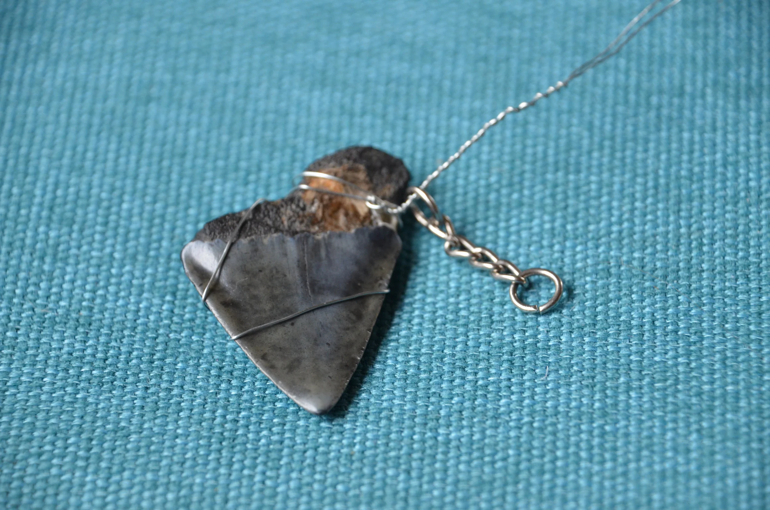 Shark tooth wire wrapping being attached to the key ring