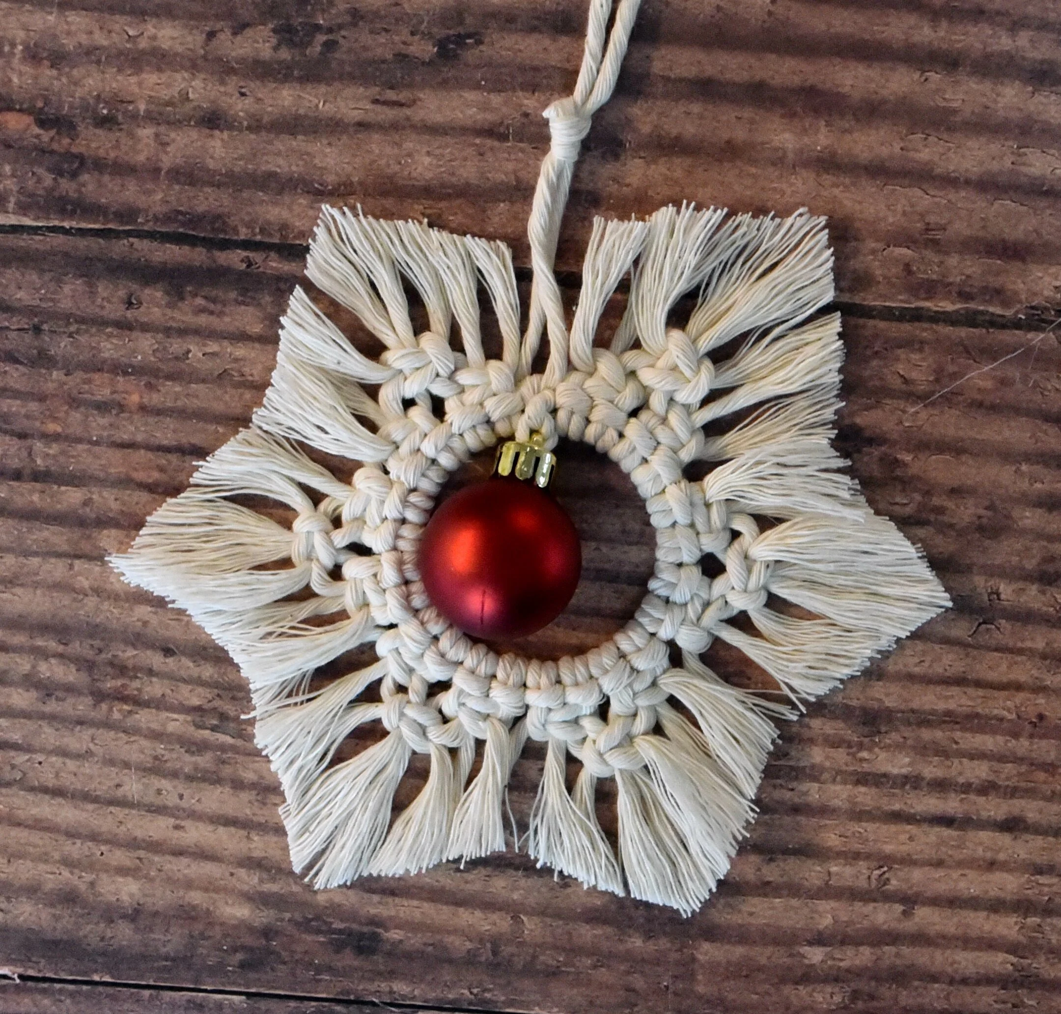 A delicate macram&eacute; snowflake ornament