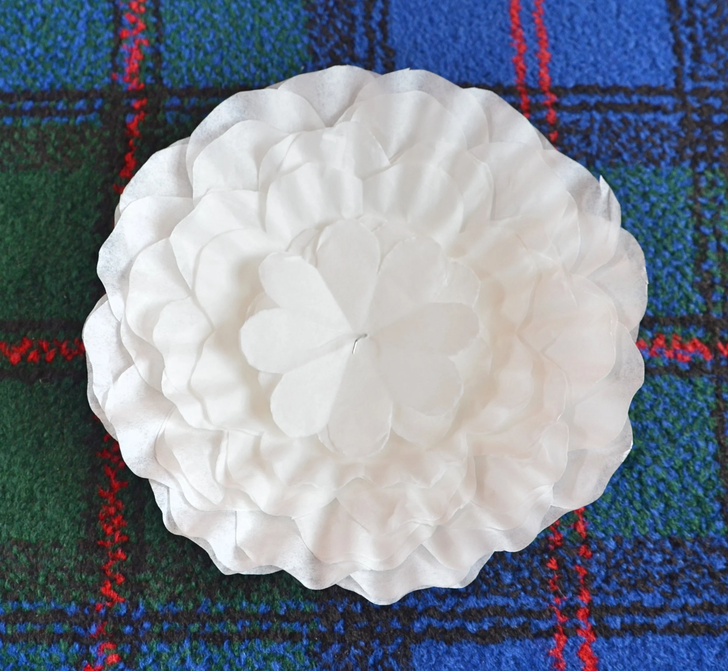 Close-up of layered coffee filter petals showing the progressive sizing